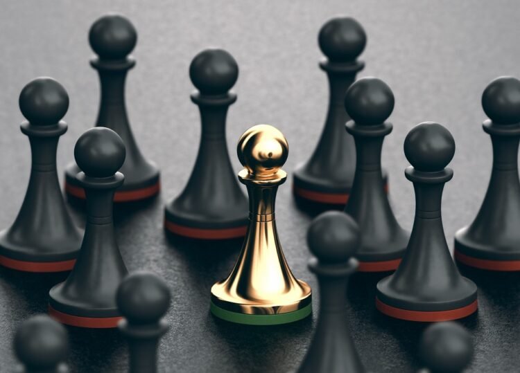 3D illustration of black pawns and focus on a golden one. Concept of uniqueness and talent.