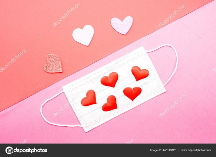 Love in times of pandemic is complicated, masks with hearts on isolated background.