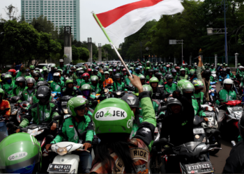 grab resmi terapkan potongan komisi